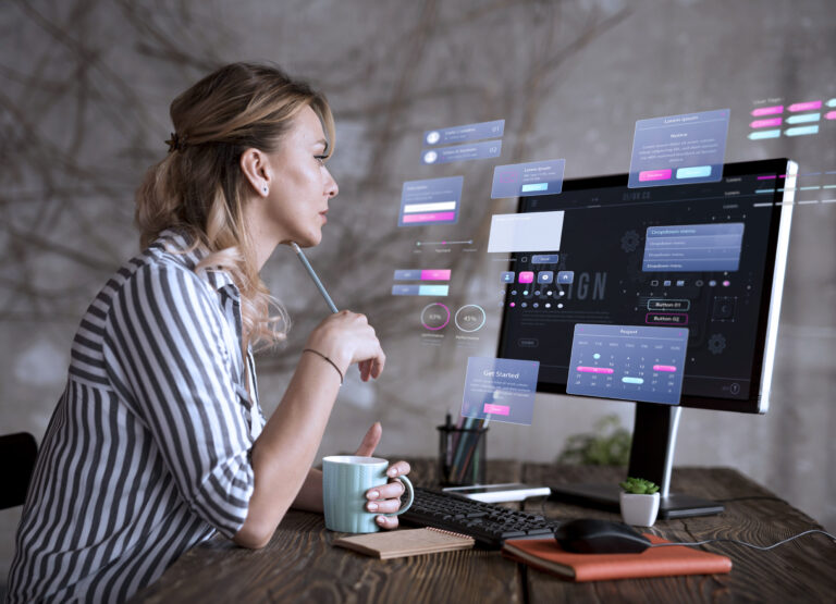 Women sits her computer as she uses data reporting tools