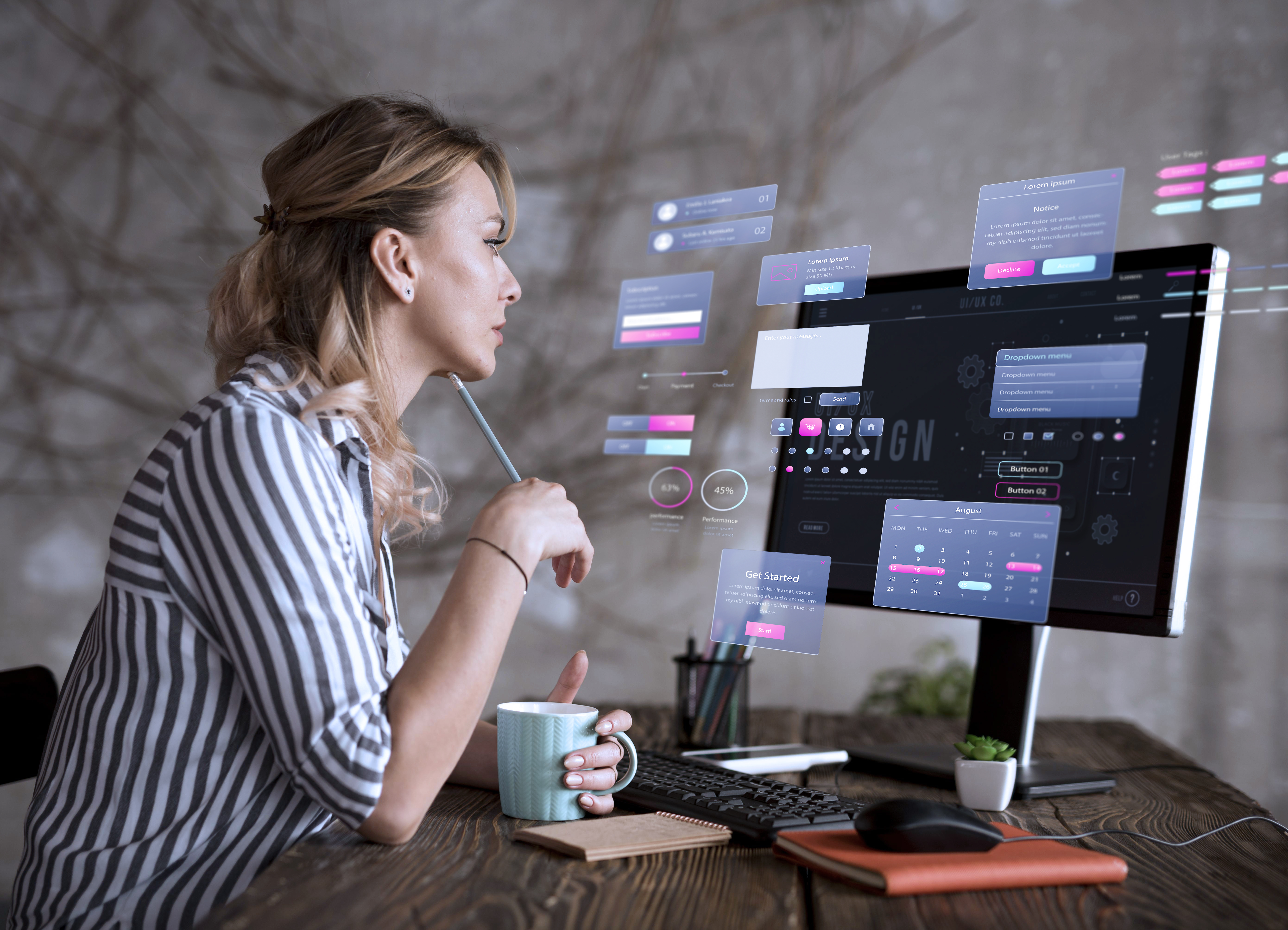 Women sits her computer as she uses data reporting tools