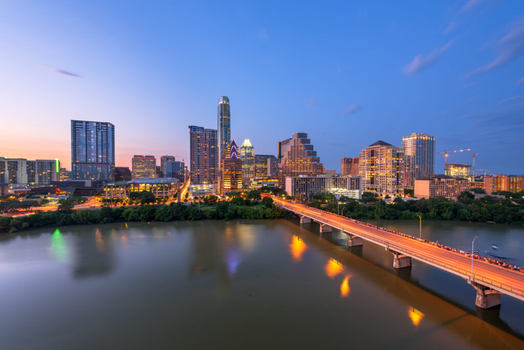 Austin, Texas, USA downtown city skyline on the Colorado River at dusk.